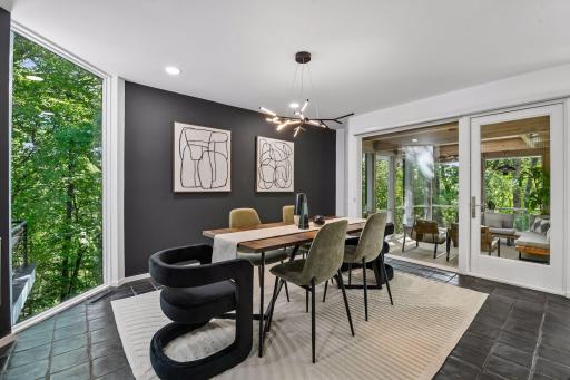 The Formal Dining Room features designer lighting, tiled flooring, and custom built-in cabinetry with a generous buffet, adding both style and function to the space.
