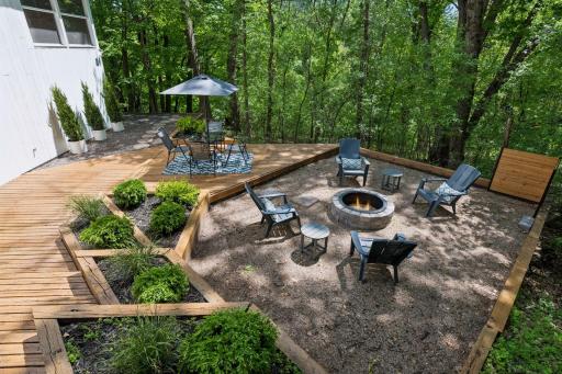 Fresh landscaping and new retaining walls enhance the side deck, creating a beautifully finished outdoor setting.