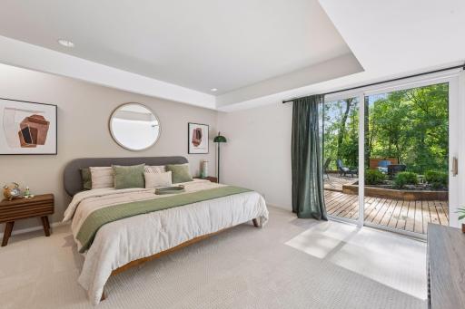 The second lower-level Bedroom offers generous space and direct access to the side deck, creating a comfortable connection to the outdoors.