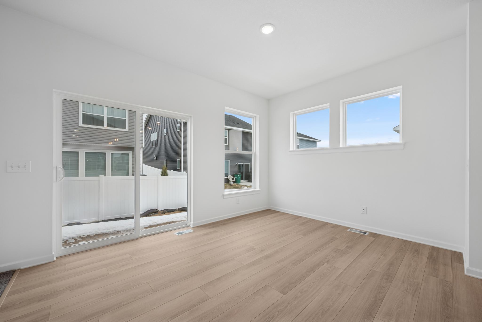 The dining area is bright and cheerful, also offering much space for entertaining. Picture of a completed Pryor home.