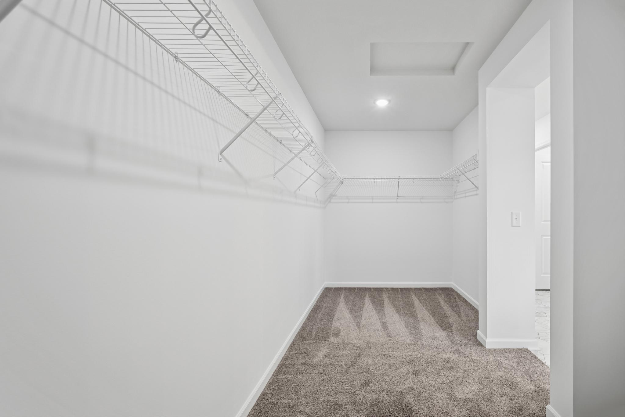 A generous owner's closet. Picture of a completed Pryor home.