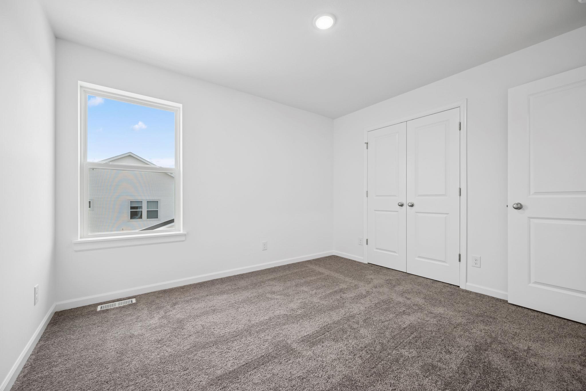 Bedroom 1, great closet space in all rooms! Picture of a completed Pryor home.