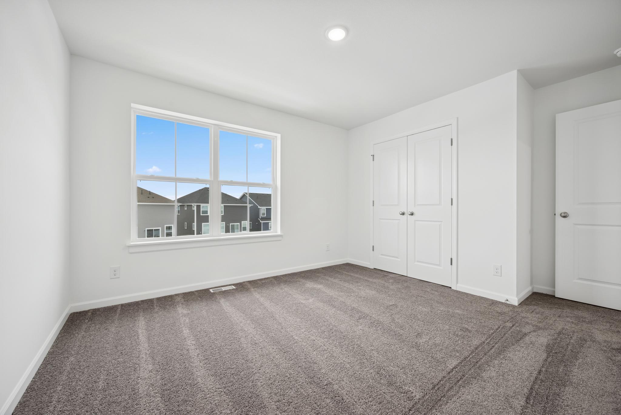 Bedroom 2, great closet space in all rooms! Picture of a completed Pryor home.