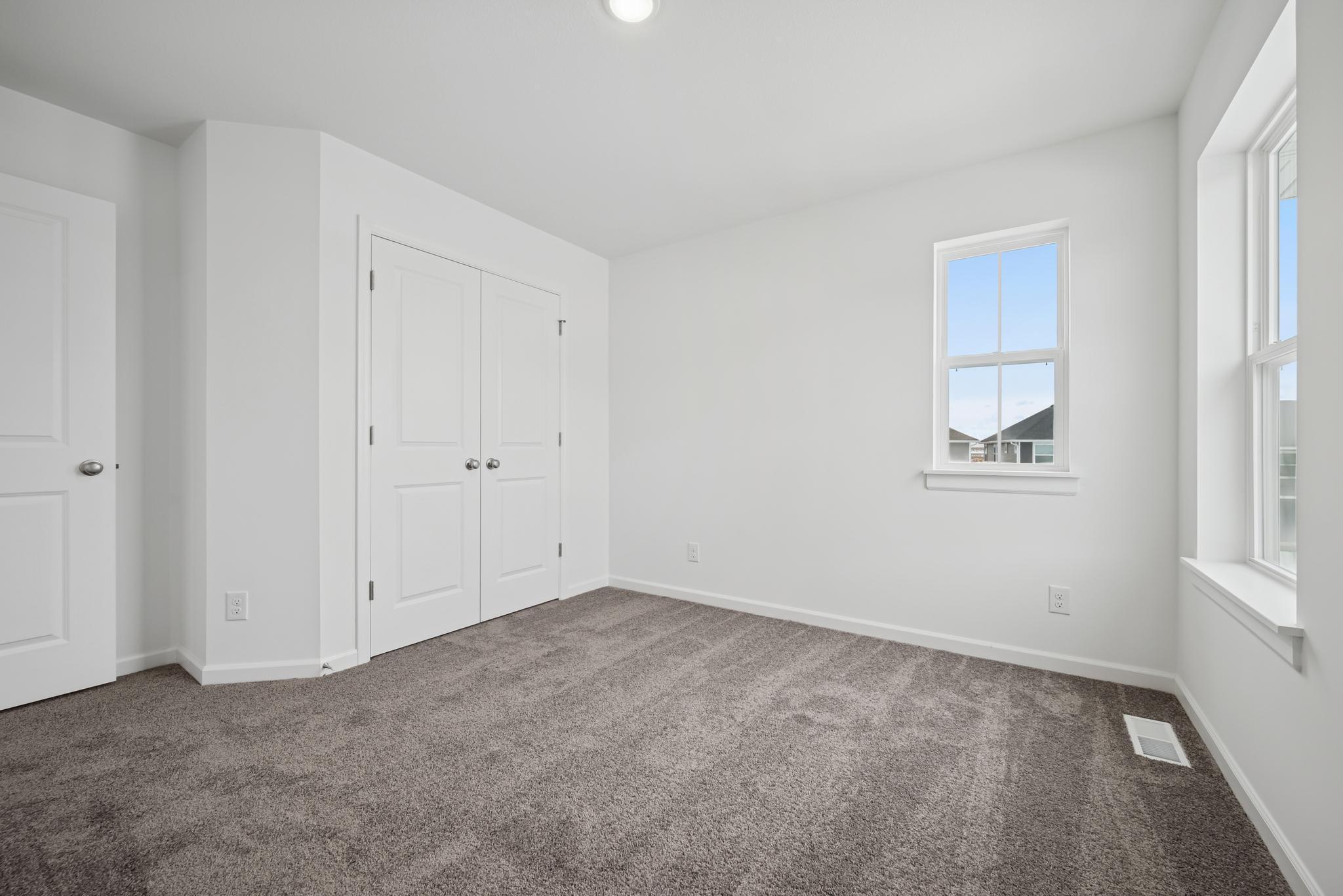 Bedroom 3, great closet space in all rooms! Picture of a completed Pryor home.