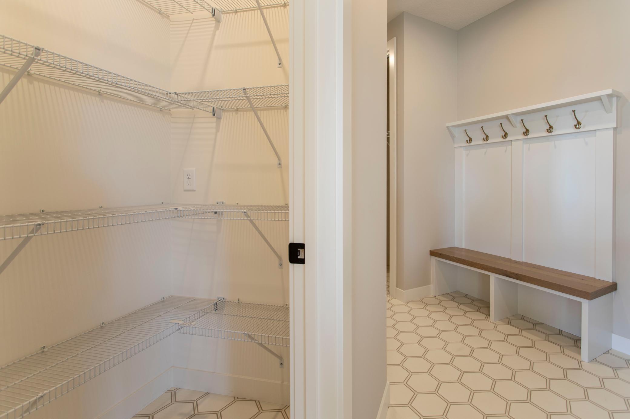 Pantry and mudroom access off 3 stall garage