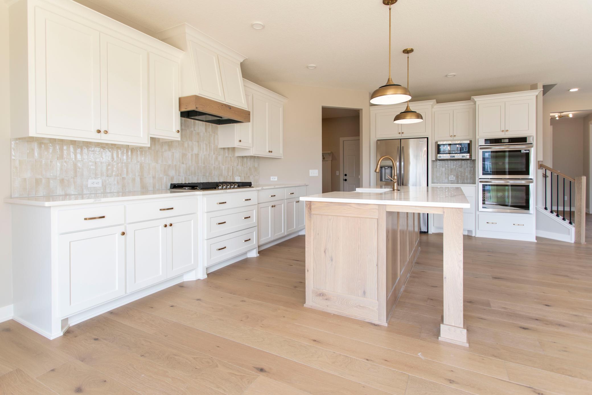 Luxury kitchen package cooktop, hood vent and custom cabinets