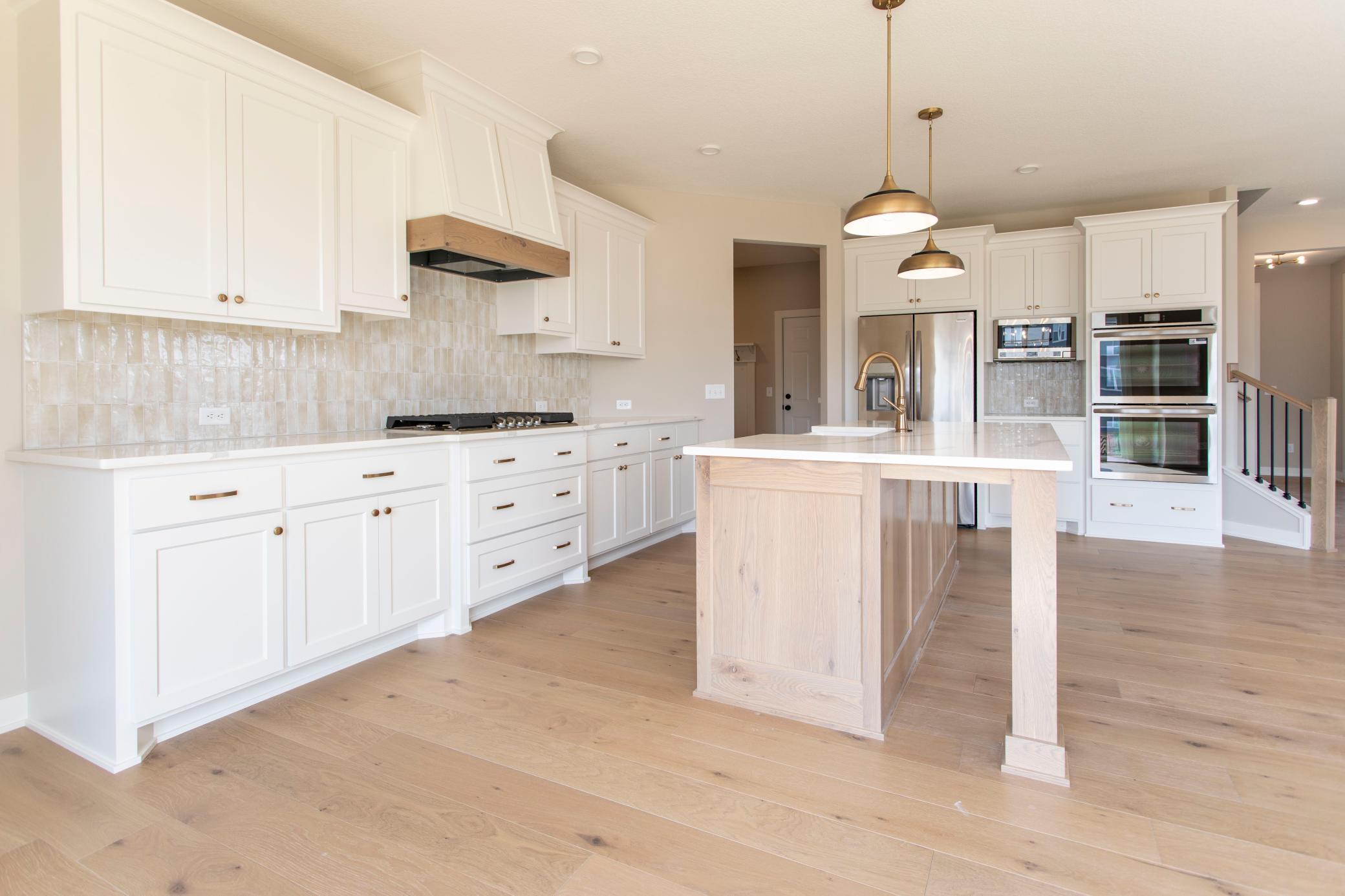 Luxury kitchen package cooktop, hood vent and custom cabinets