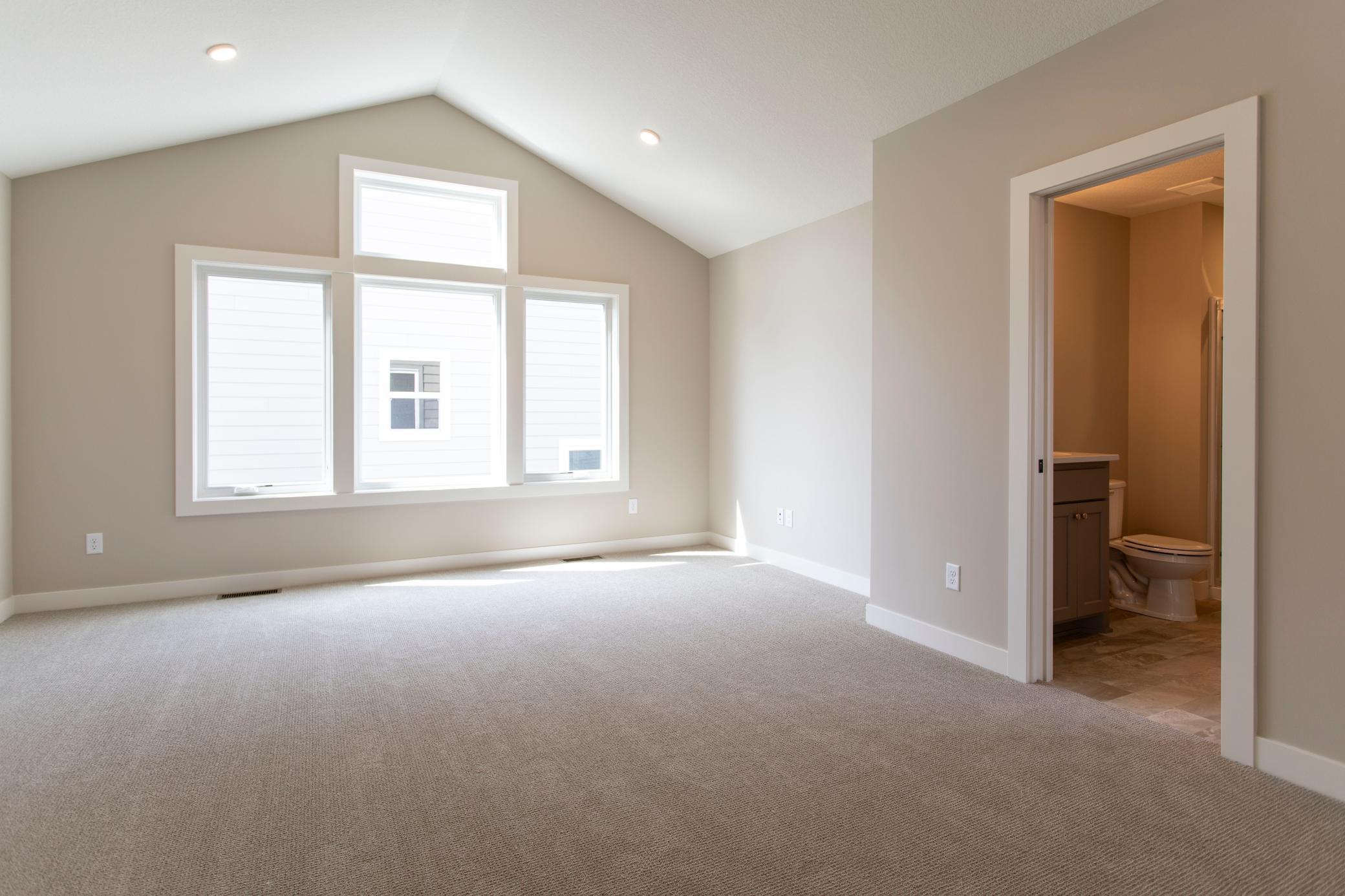 Upstairs large bonus room great space for another living room set up or kids homework area.