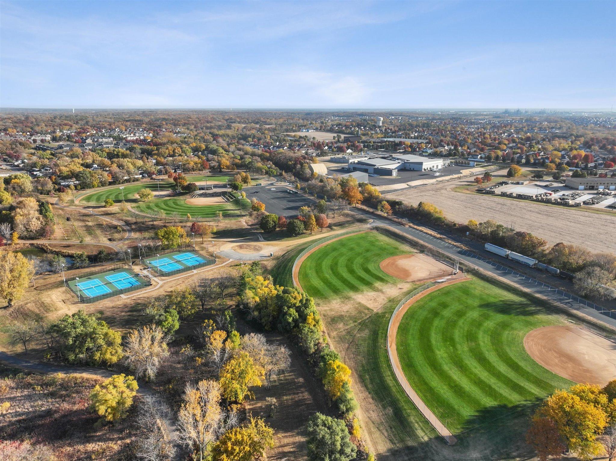 Erickson Park-Picnic shelter, concession area, 5 regulation Softball fields, 3 with field lights, and 4 tennis courts.