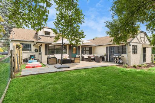Expansive back patio is great for entertaining and provides a view of the golf course and access to the huge garage with gardening shed and workshop space.
