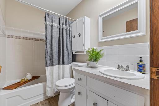 The full bathroom is convenient to all bedrooms and all other main-level living spaces making it ideal for guests and everyday use.