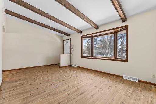 New vinyl plank flooring flows throughout the main level for a cohesive look.