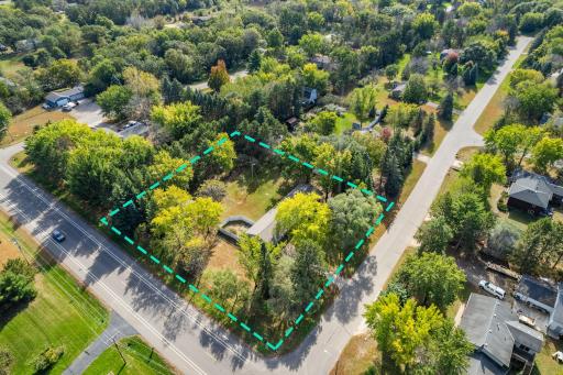 Situated on nearly an acre, this peaceful setting offers added privacy with a fenced patio area and mature trees surrounding the property.