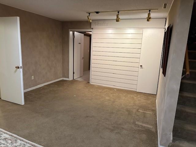 Carpeted room in basement