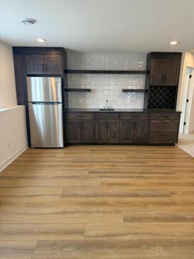 Lower-level wet bar is waiting for you to entertain