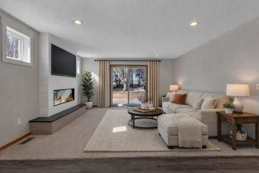 AI STAGED; Cozy modern living room with fireplace.png