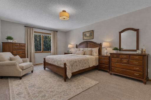 AI STAGED; Classic master bedroom in daylight.png