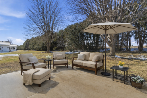 AI STAGED; Peaceful patio retreat with nature's view.png