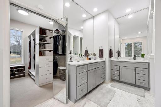 Two separate vanities in the primary bathroom