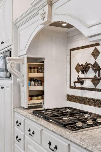 Amazing details like hidden spice racks take this kitchen to another level