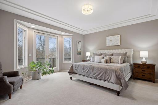 The main floor primary bedroom suite is a welcome respite