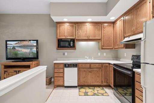 The lower level apartment has a full kitchen