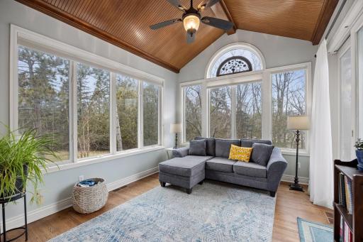 Cozy sunroom with a stunning wood ceiling
