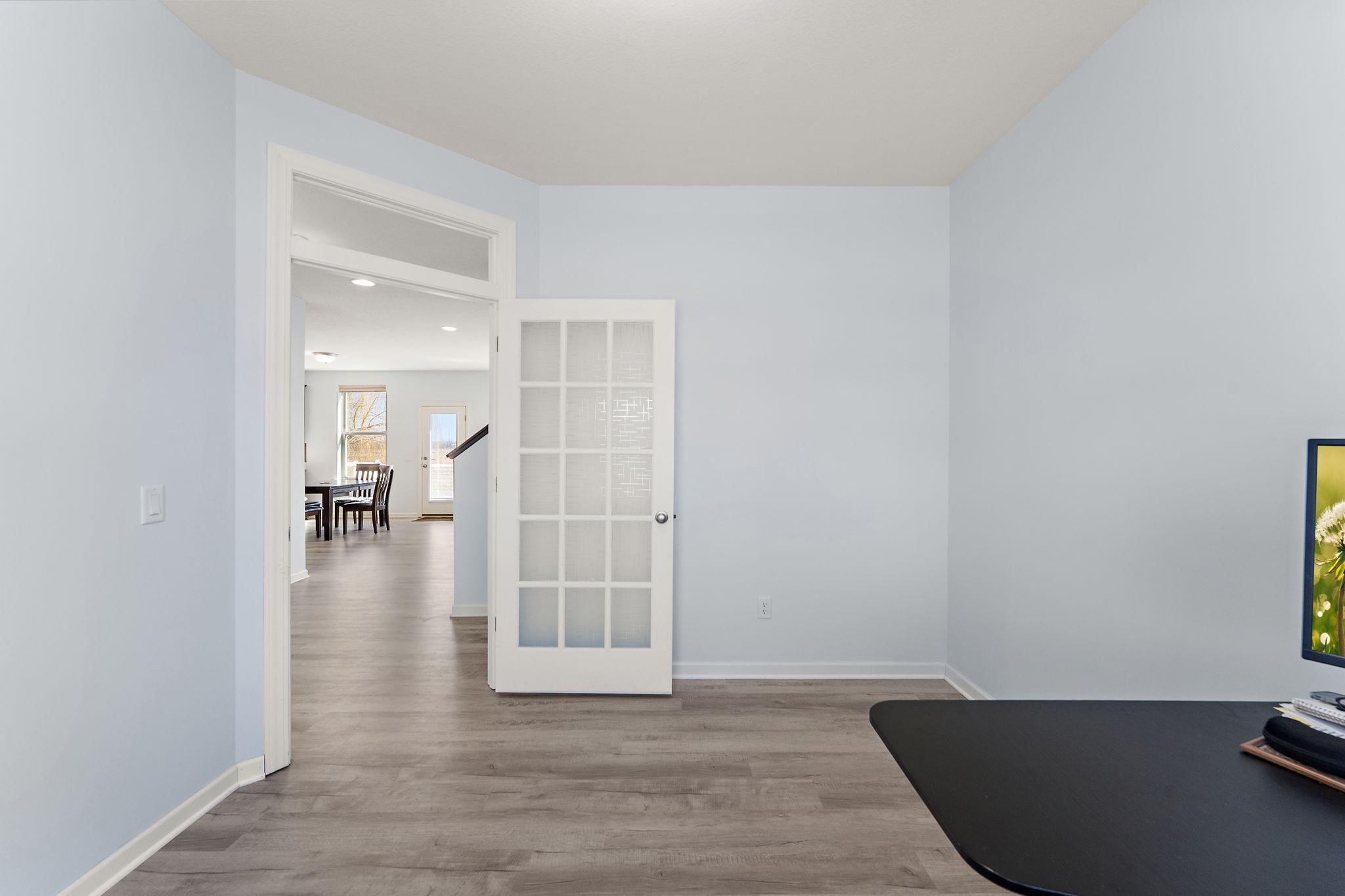This versatile space features elegant French door and plenty of room for a dual-desk setup or a potential guest room conversion.