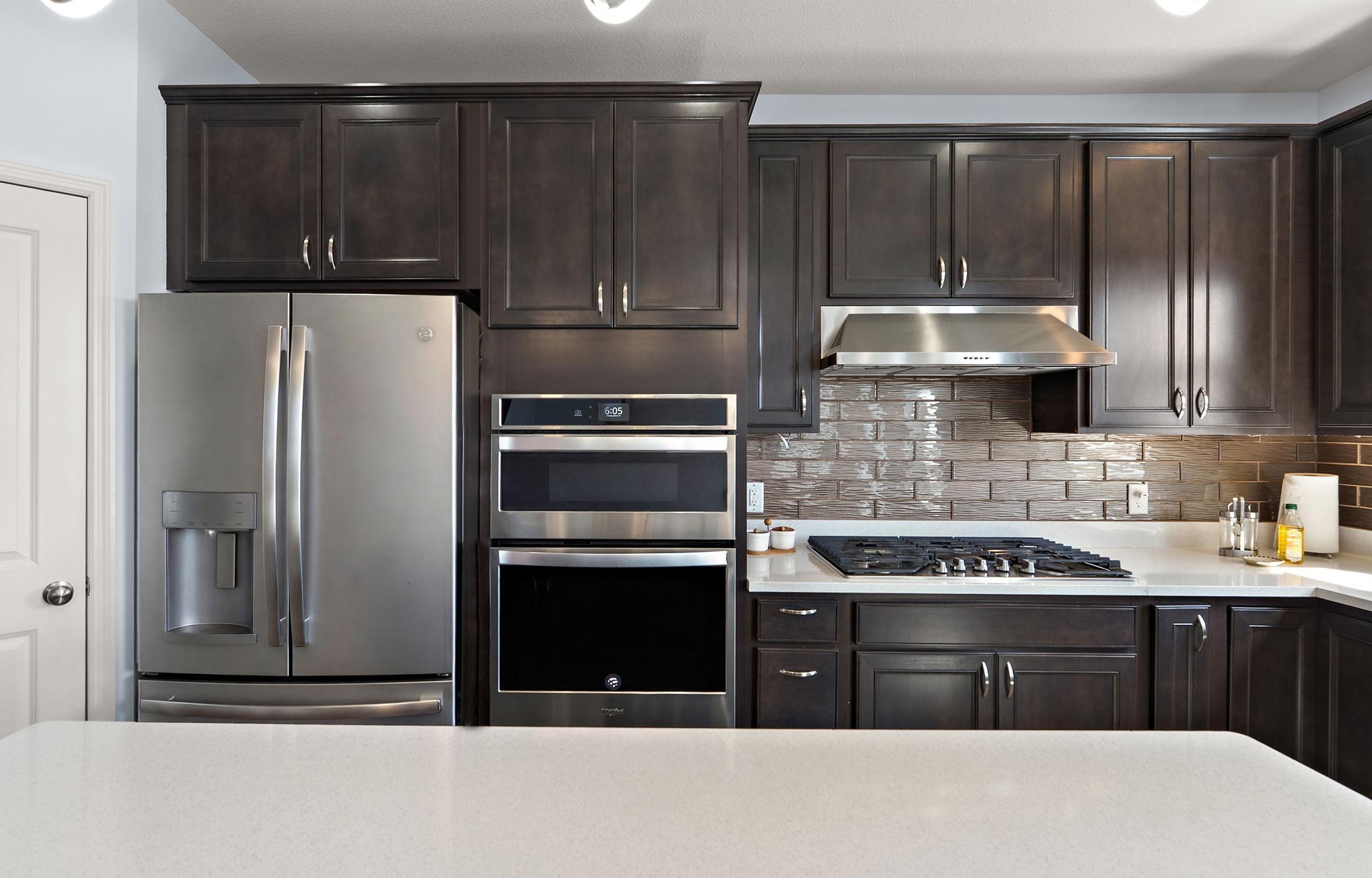 The expansive center island offers plenty of prep space and a perfect spot for casual bar-stool seating!