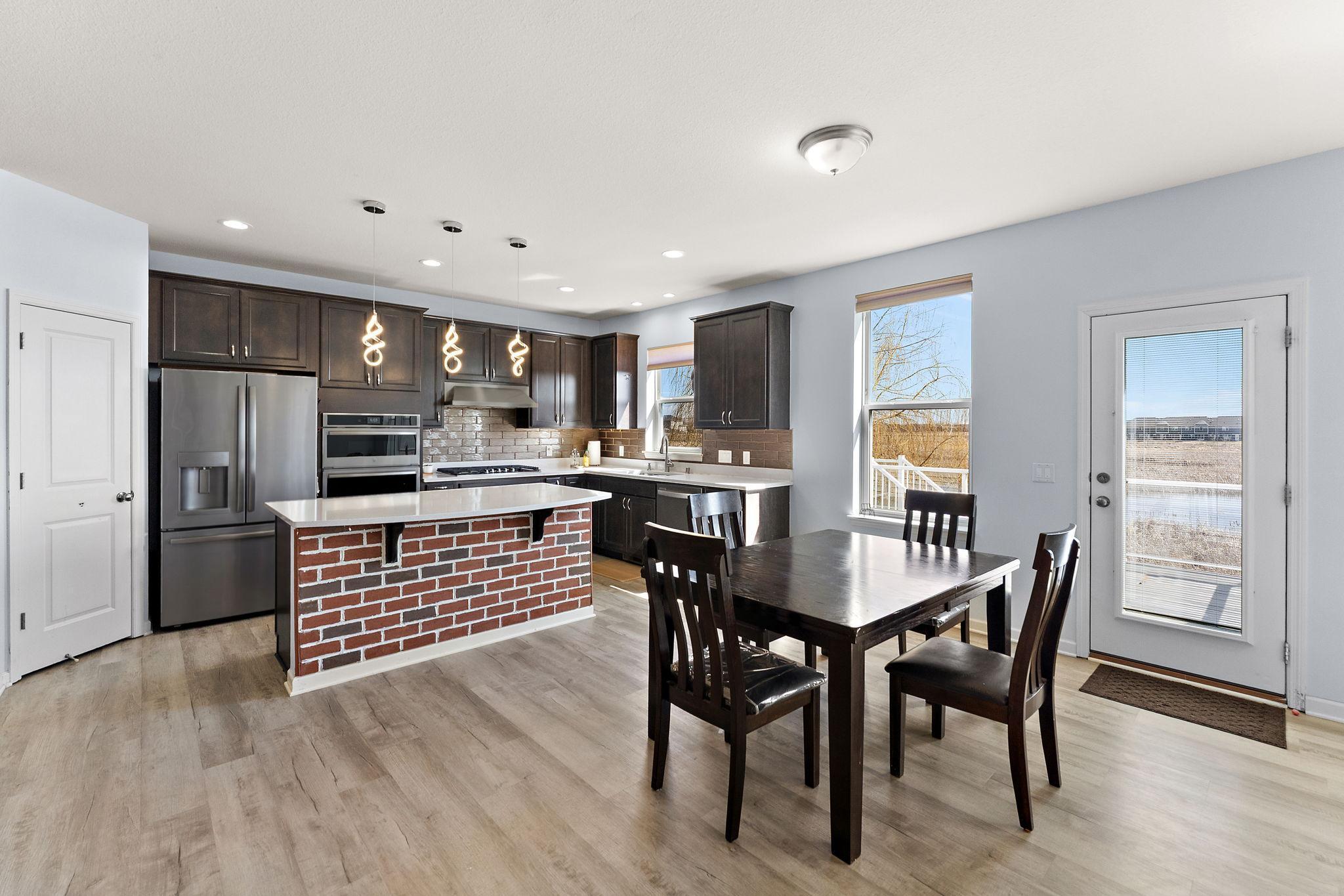 Stunning panoramic views of the protected wetlands through a wall of windows. This space captures the "nature retreat" feel while maintaining a modern, clean aesthetic.