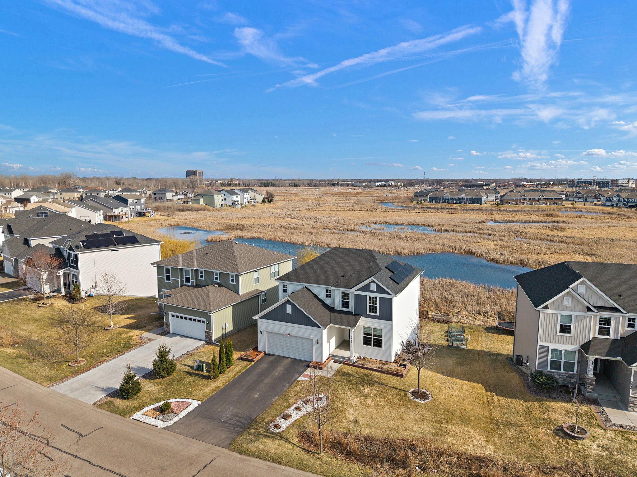 Striking curb appeal! This view showcases the modern architectural lines and the pristine, 100% chemical-free lawn.