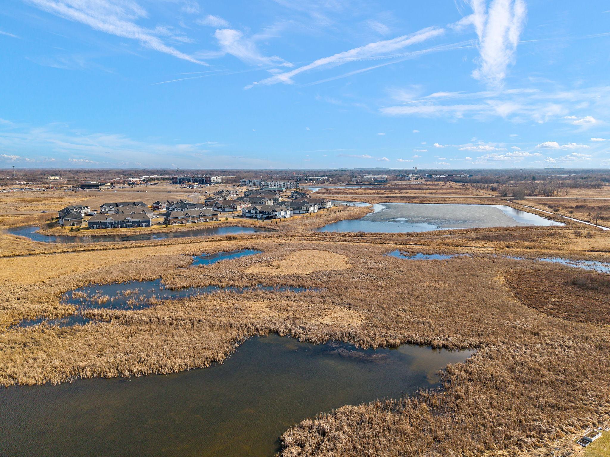 A rare and tranquil backdrop! Your backyard opens directly onto a protected nature preserve and serene pond, ensuring privacy and a front-row seat to Minnesota’s local wildlife.