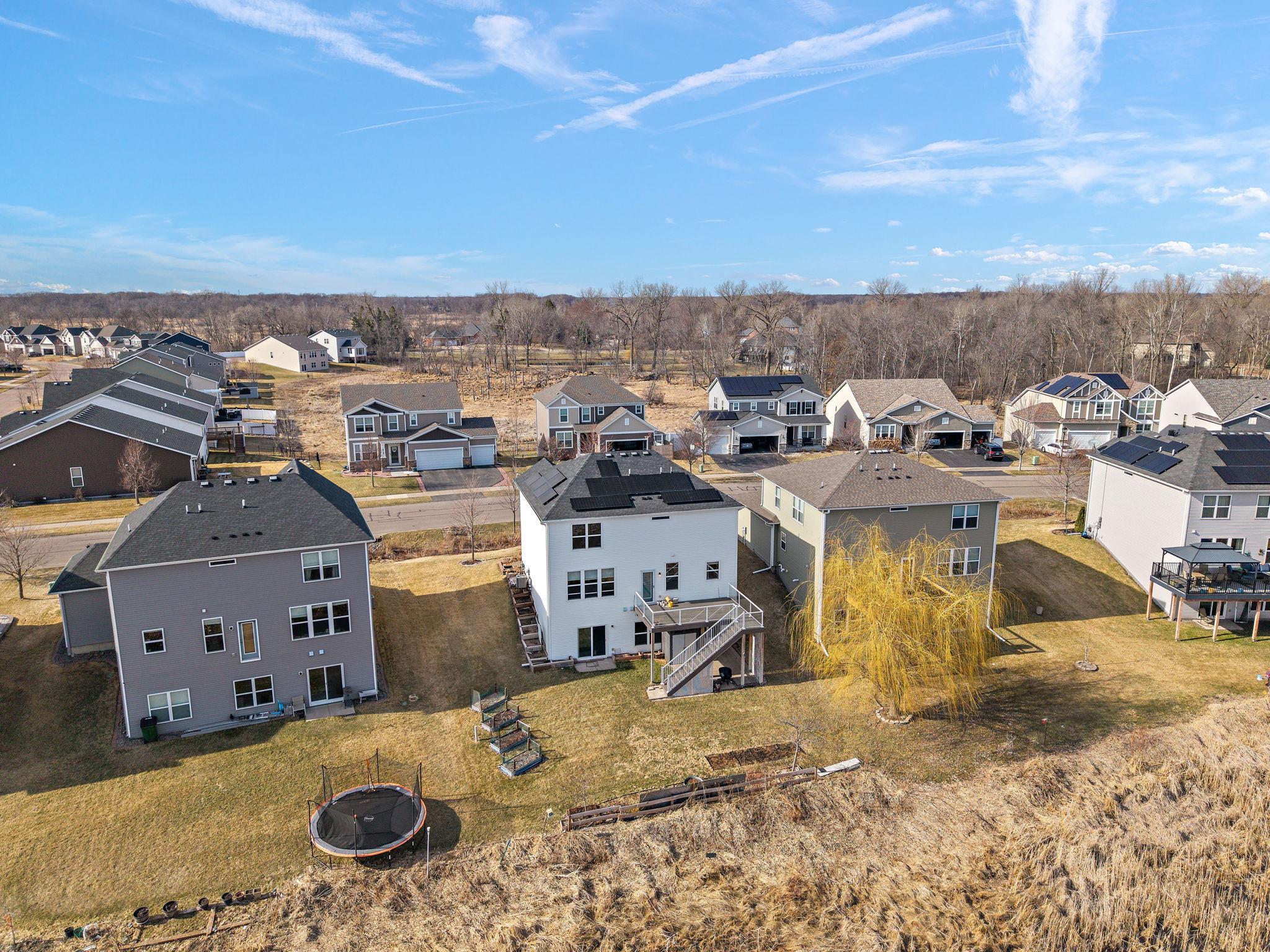 Embrace true energy independence! This high-angle shot showcases the fully owned 6.2 KW solar panel system, expertly installed for maximum efficiency.