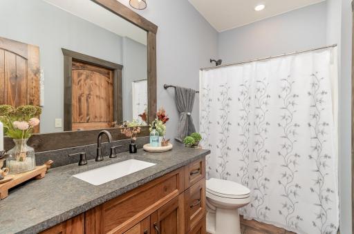 Full bathroom with walk thru access to third bedroom.