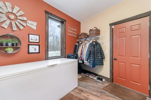 Large mud room off of attached two stall garage. Mud room also has access to dropped mechanical room.