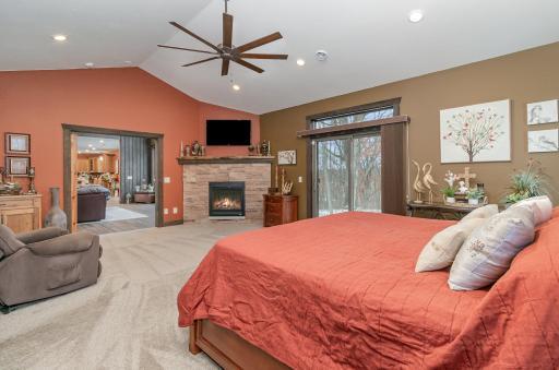 Fireplace with stone surround in master