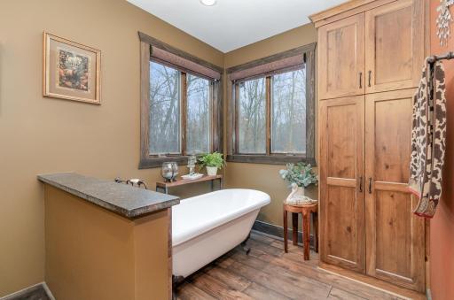 Claw foot soaking tub in master bath in master