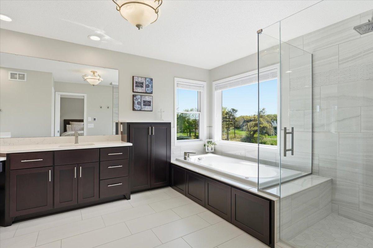 Separate jetted tub and shower.