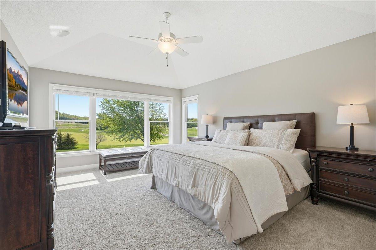 Upper level primary suite receives ample natural light.