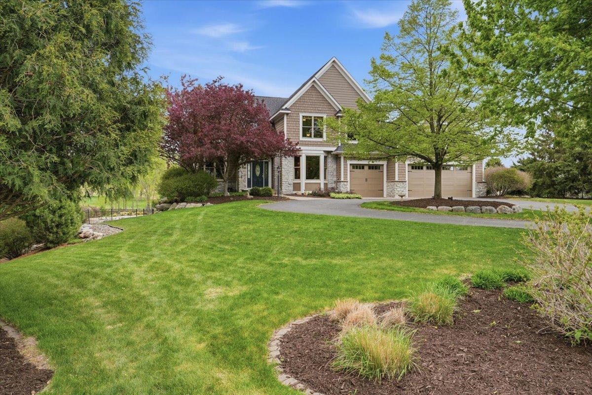 Lush landscaping and sprawling green space welcome you home!