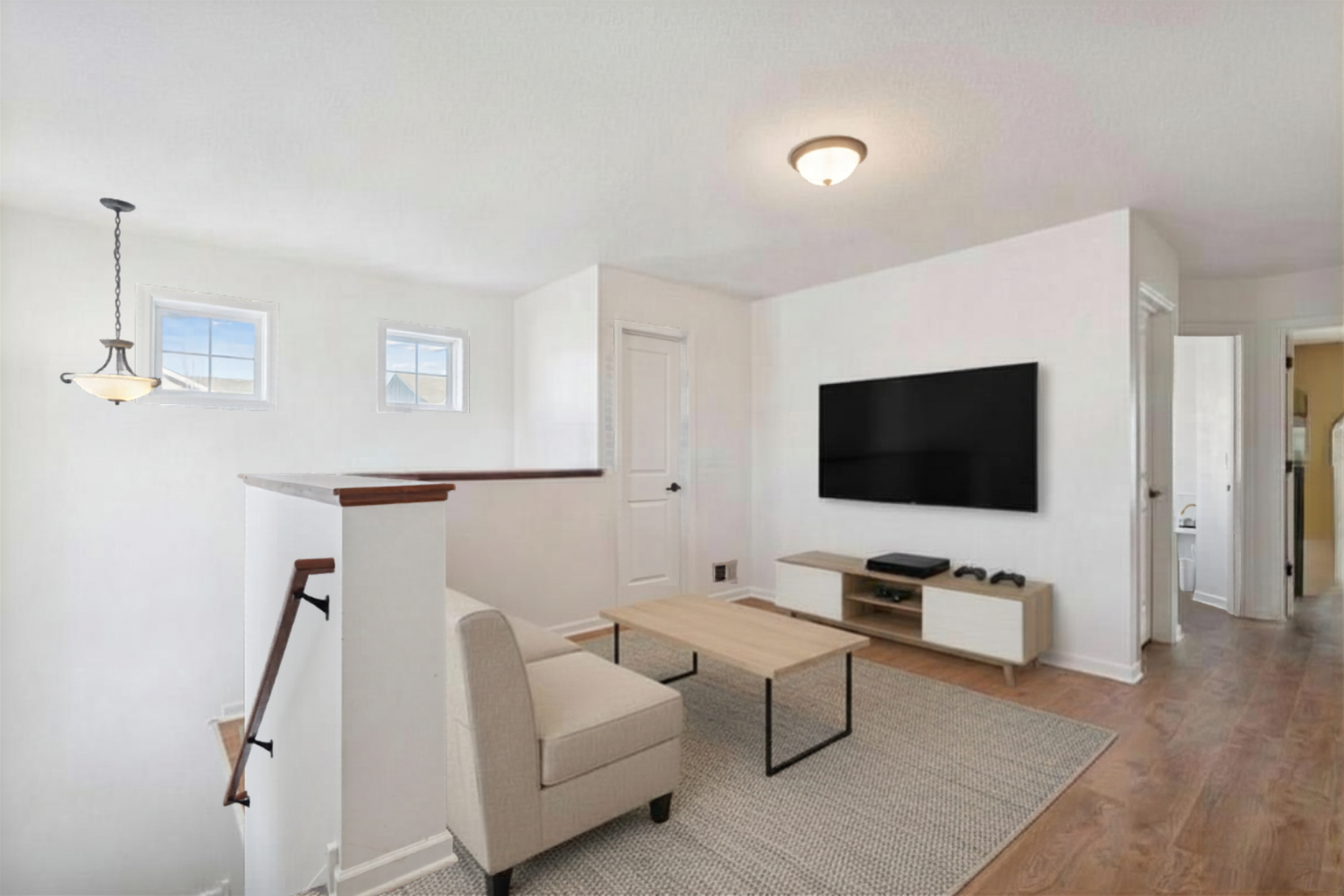 The loft is a useful space that can be your work zone or a second family/gaming room. Room is virtually staged.