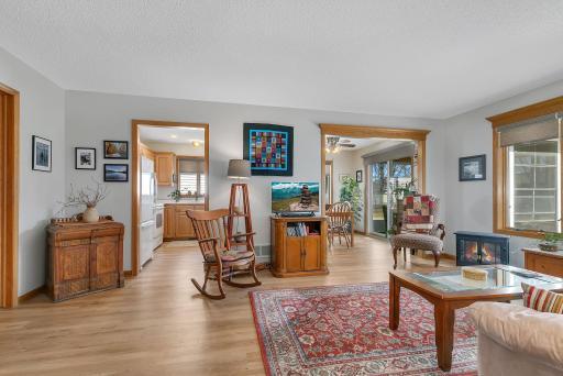 Living room leading to kitchen and dining
