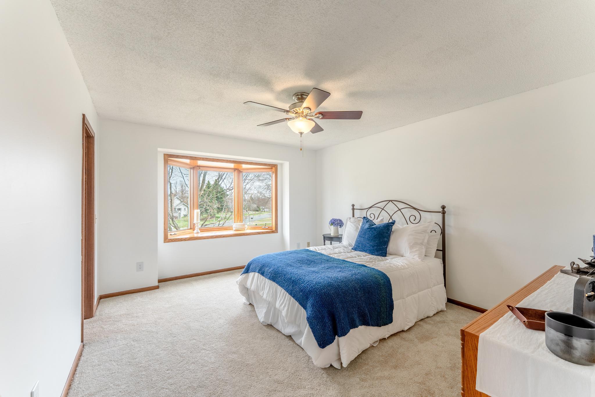 A spacious primary retreat that feels calm, bright, and private.