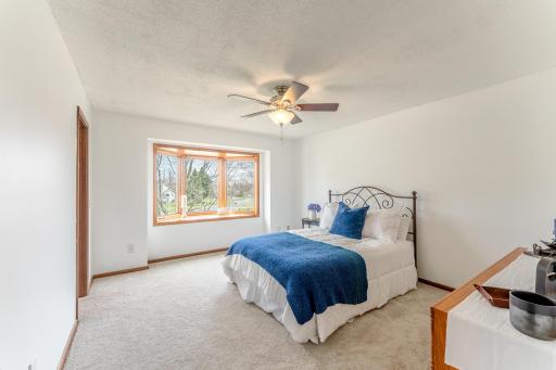 A spacious primary retreat that feels calm, bright, and private.