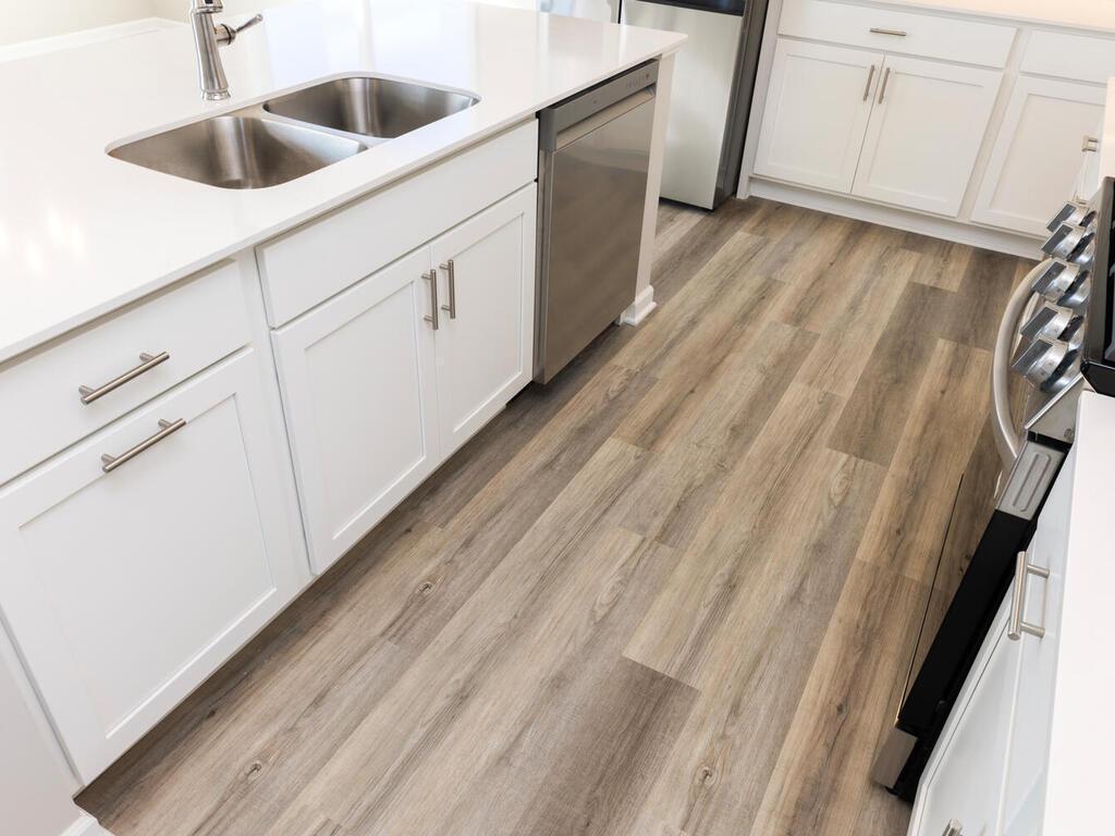 PHOTO OF A DIFFERENT HOME WITH SIMILAR PLAN. FINISHES MAY VARY. Spacious Kitchen Center Island.