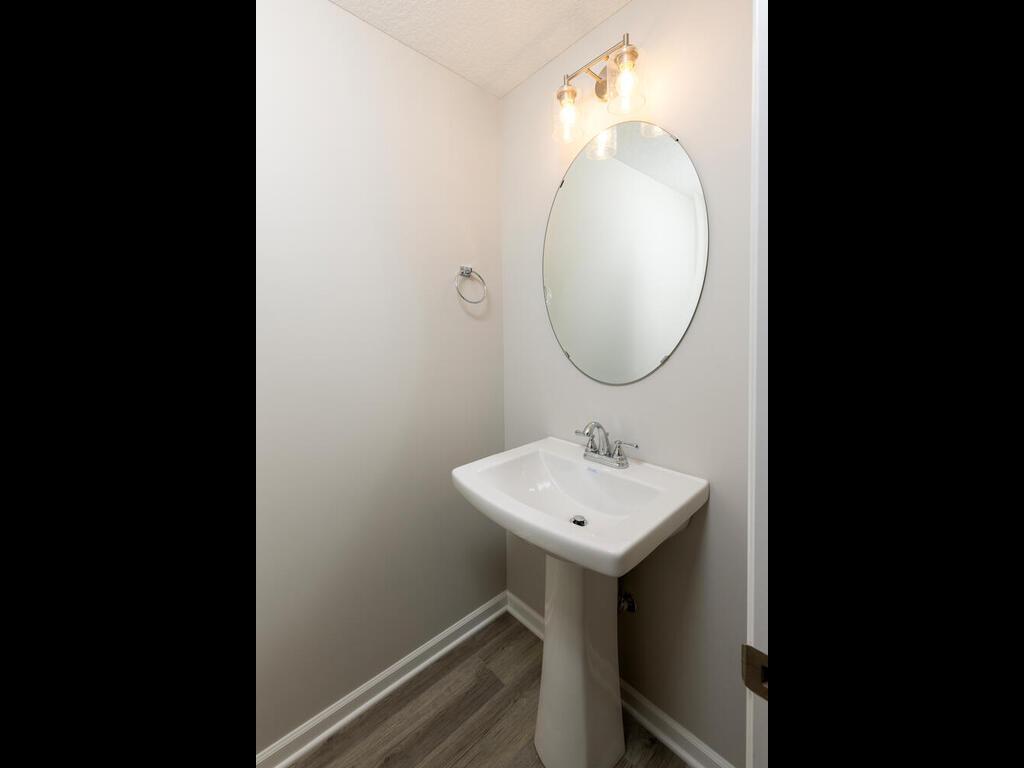 PHOTO OF A DIFFERENT HOME WITH SIMILAR PLAN. FINISHES MAY VARY. Main Floor Half Bath
