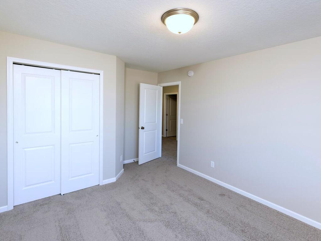 PHOTO OF A DIFFERENT HOME WITH SIMILAR PLAN. FINISHES MAY VARY. Bedroom 3