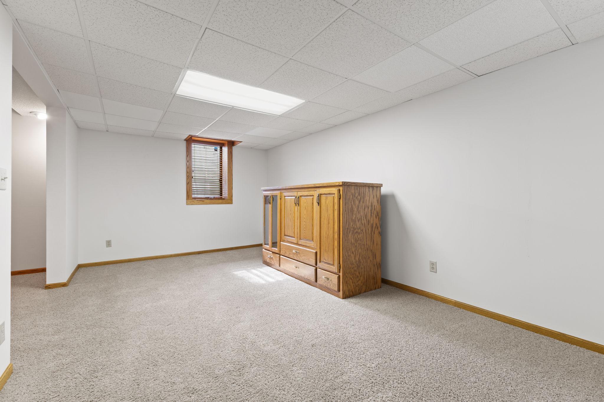 This space could easily be made into a 4th bedroom with the egress already in place.