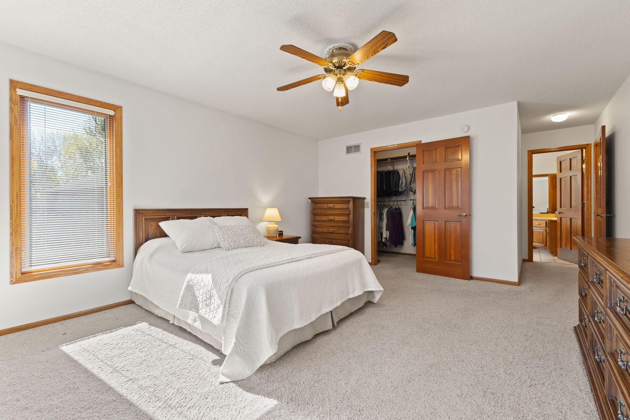 Ceiling fan for all season comfort plus walk in closets offering ample storage.