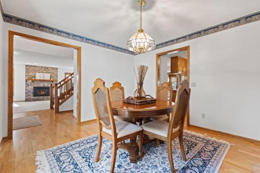 Festive gatherings & memorable conversations will happen in your spacious dining room. The continuous hardwood floors flow seamlessly into the adjacent rooms making this the perfect space for casual everyday meals or entertaining family & friends.